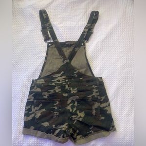 These Camo overall shorts from Almost famous short tall. Size medium.